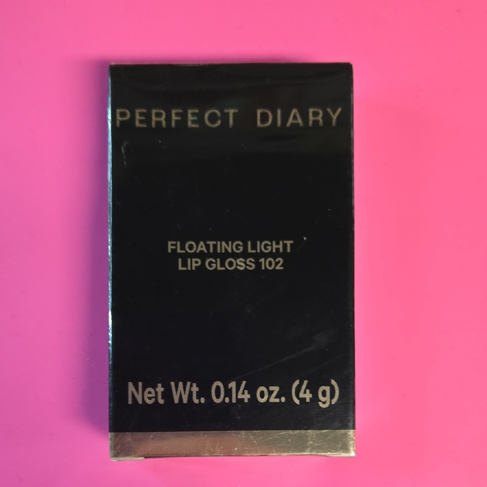 Floating Light Lip Gloss Shade 102 Peach Pomelo Tea- Black and Gold